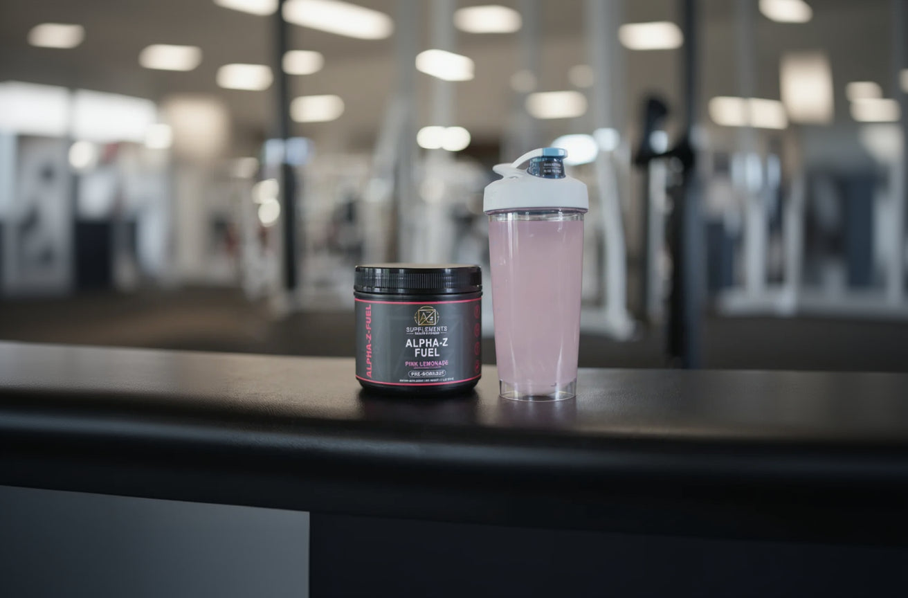 Two containers of Alpha Fuel on a counter with a blurred background